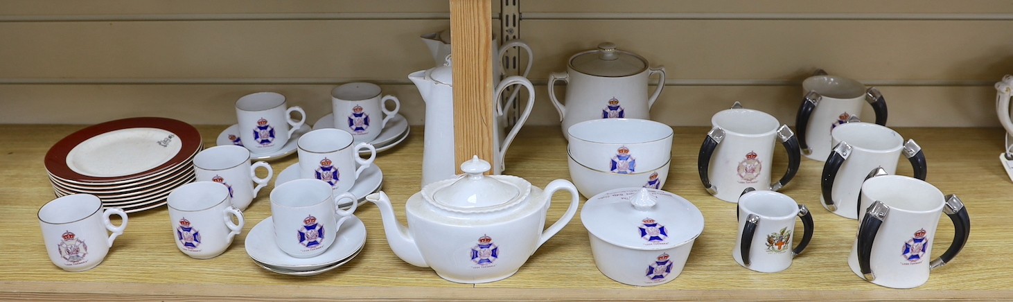 Society of Miniature Rifle Clubs - A large group of commemorative porcelain tea wares, three handled tygs and plates awarded for skill in rifle shooting, early 20th century